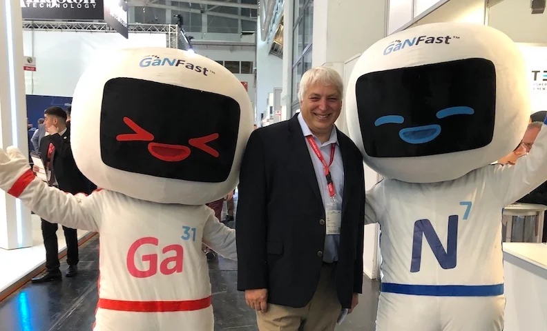 Navitas says the acquisition of Halo will help them integrate silicon controller capabilities with its GaN and SiC technologies. Shown here, All About Circuits Editor-in-Chief, Jeff Child poses with Navitas’ GaN and SiC “mascots” at Electronica 2022 last November.