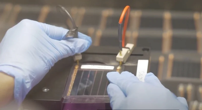 Dracula researcher testing the performance of a LAYER organic photovoltaic cell