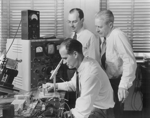 John Bardeen (top), shown here with his fellow Bell Labs engineers William Shockley (right) and Walter Brattain (seated).