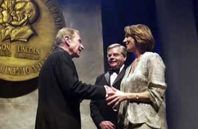 Ray Dolby (left) is inducted into the National Inventors Hall of Fame. NIHF president Rick Nydegger (center); United States Patent Office's Anne Chasser (right).