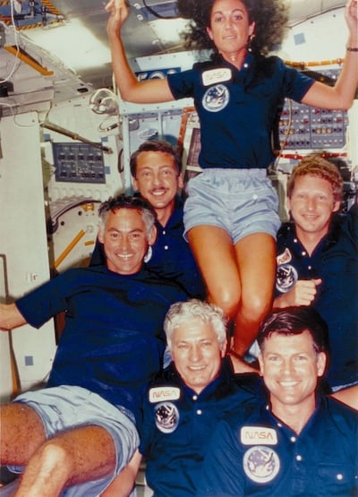 Resnik with other members of the Discovery crew